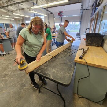 Accountants volunteer at grand junction colorado nonprofit making beds at sleep in heavenly peace
